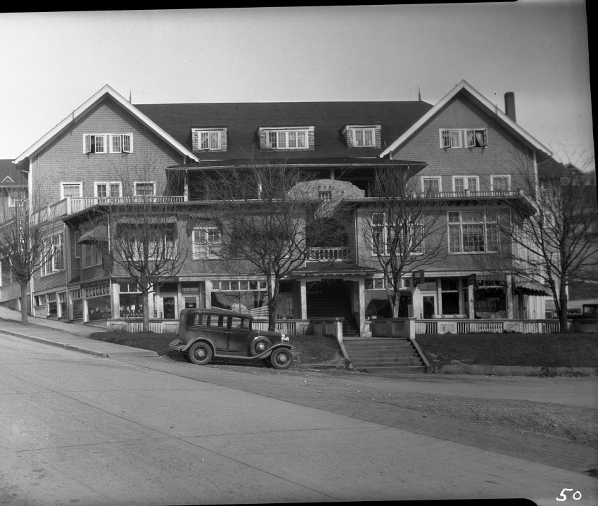 Rodmay Hotel. 1930. Car is either a 1930 Chevrolet, or a 1930 Pontiac.
