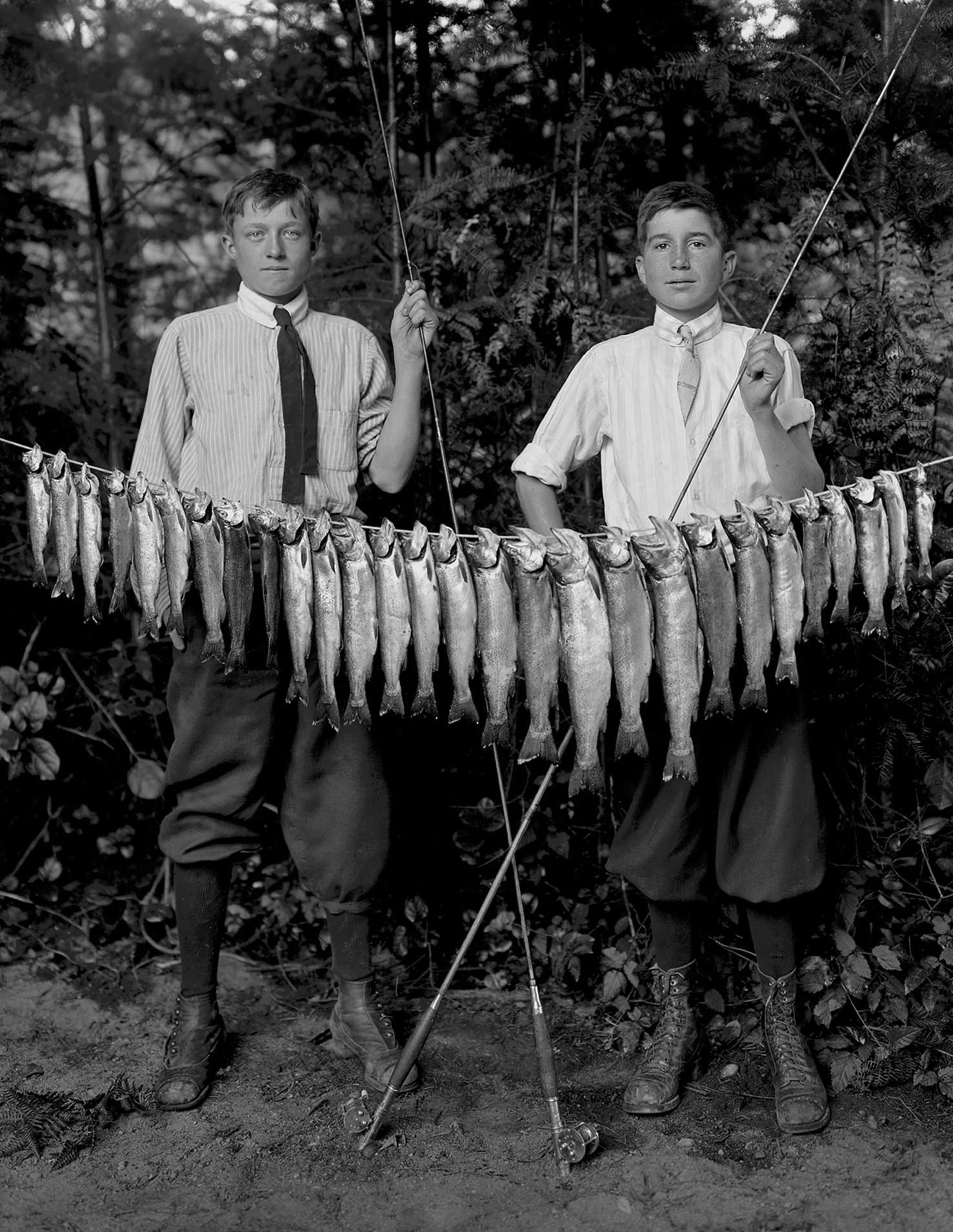 Dressed in their Sunday best. Powell River boys with trout, Ca. 1913.